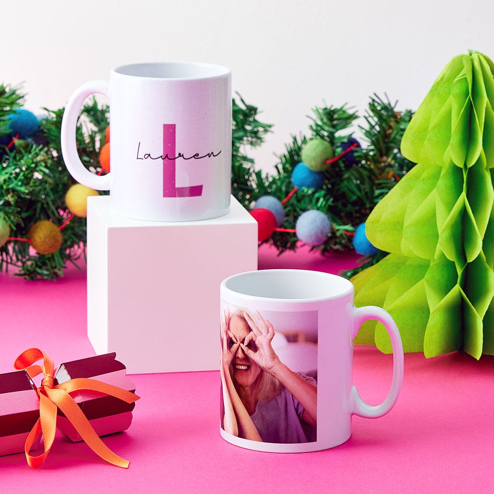 Two personalised mugs, one with a photo and one with a name and initial